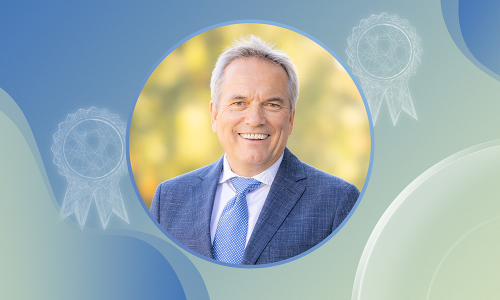 Headshot of male scientist against an abstract illustration of blues and greens.