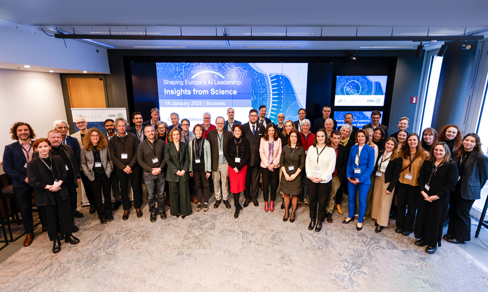 A group picture of the event participants in front of a slide displaying text: "Shaping Europe's AI Leadership: Insights from Science; 14 January 2025 | Brussels".