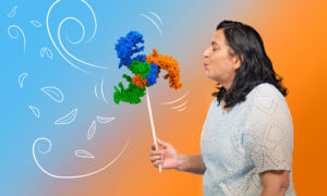 Side photo of a woman wearing a white top and blowing into a handheld pinwheel but instead of the plastic windmill we can see the PIEZO1 protein structure which looks like a propeller with three arms.